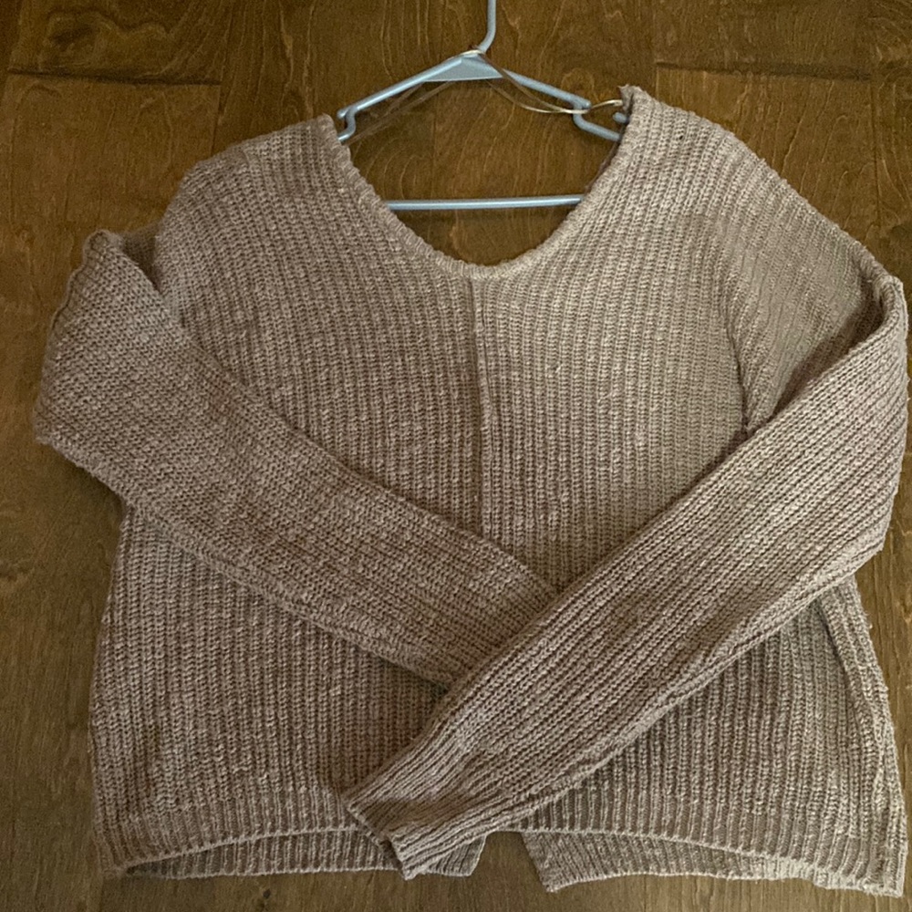 Brown/tan sweater, buttons I’m the back.